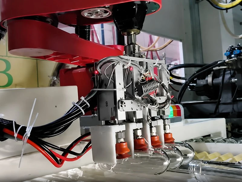 Automatic Pick-up of Preforms Automatic Pick-up of Preforms
